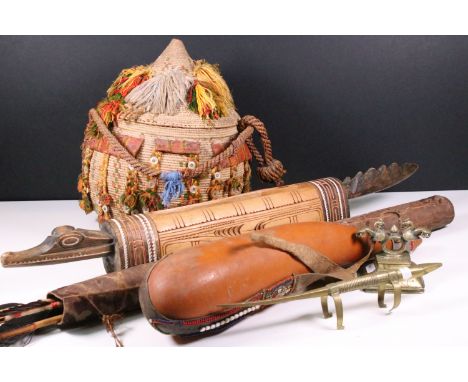 Mixed tribal items to include a woven Egyptian lidded basket with mother of pearl buttons, African Maasai Gourd milk flask, c