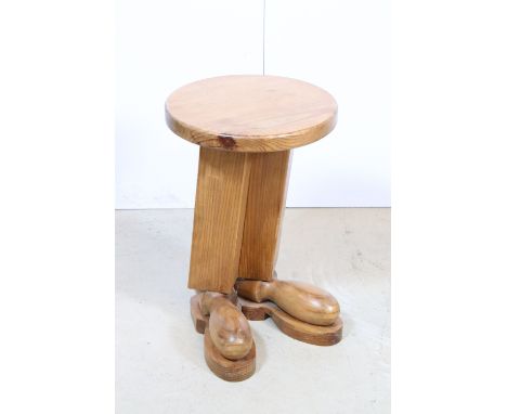 20th century small novelty pine round top side table with 'feet' detail to base, H 44cm, 29cm diameter
