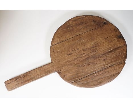 Vintage wooden circular bread board with handle, 69cm long