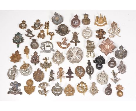 A collection of fifty British regimental military cap and collar badges to include The 3rd Kings Royal Irish Hussars, Northum