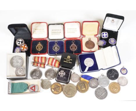 A collection of medals and medallions to include a good selection of silver and enamel examples. 