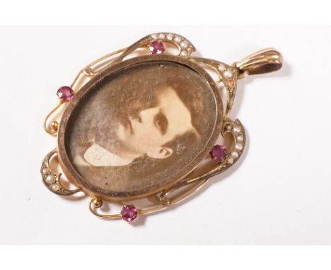 An antique 9ct gold open double sided locket with amethyst and seed pearl decoration. 