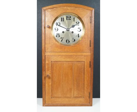 Arts and Crafts wooden case wall clock with keys and winder, H 63.5cm