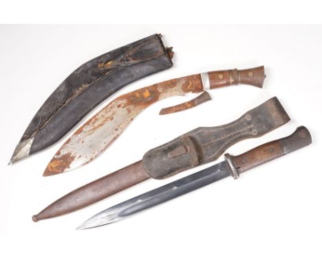 A World War Two K98 bayonet with scabbard and leather frog together with a Kukri knife. 
