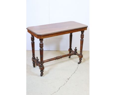 20th century small side table raised on turned legs and base stretcher with casters, H 69cm, W 90cm, D 44cm