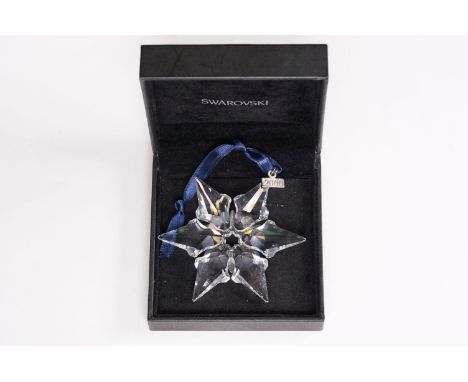 A Swarovski millennium year 2000 star christmas decoration. 