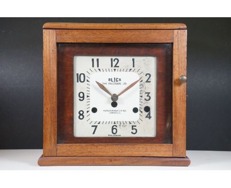 Early 20th century wooden cased Blick time recording clock with front opening glazed door, H 36.5cm, W 39cm, D 20cm