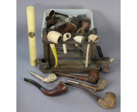 A collection of assorted meerschaum &amp; briar pipes, cased &amp; uncased; &amp; a pipe-smokers rack.