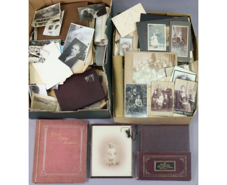 A collection of vintage family photographs &amp; postcards, in albums &amp; loose. 