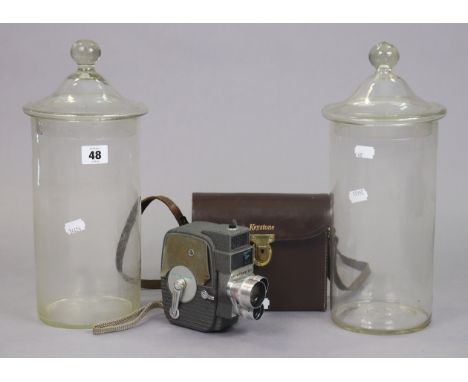 A Keystone “Electric Eye” 8mm cine-camera, with case; &amp; a pair of clear glass cylindrical storage jars, 34cm high. 