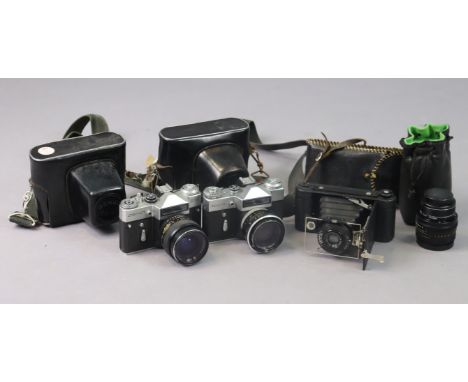 A Houghton-Butcher folding camera; two Zenit cameras; &amp; a Zenit camera lens, all cased.