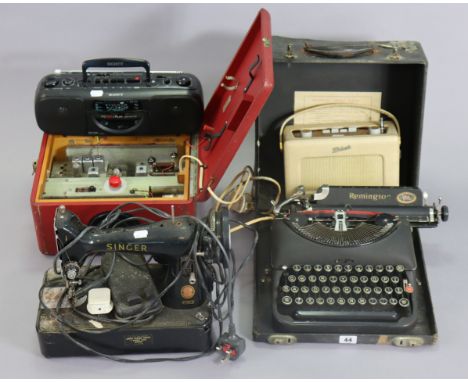 A Remington portable typewriter; two Roberts radios; a Singer electric sewing machine, etc. 