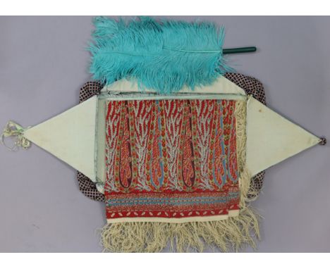 A vintage Paisley shawl with all-over multi-coloured geometric design; a feather fan; &amp; a garment case.