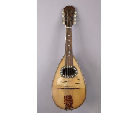 An Italian mandolin, Bears paper label “Felice Cavalacci &amp; Figlio, Napoli”, 60cm long, lacking case.