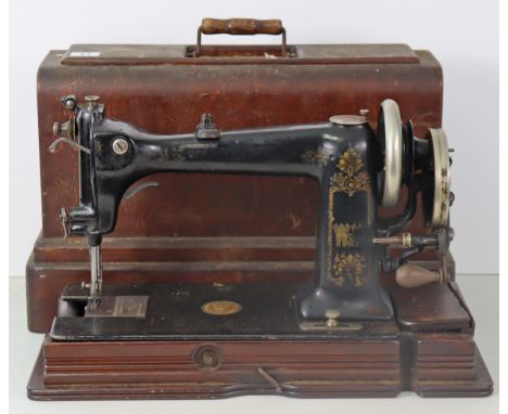 An early 20th century American hand sewing machine by Wheeler &amp; Wilson of Bridgeport, Connecticut, USA (model D-9), with 