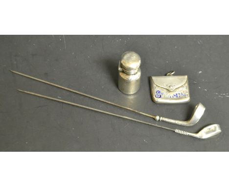 An Edwardian silver-mounted hat pin, as a golf club and ball, steel blade, 14.5cm long, rubbed marks; another, similar, rubbe