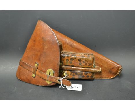 A leather luger holster, with compartments and tools