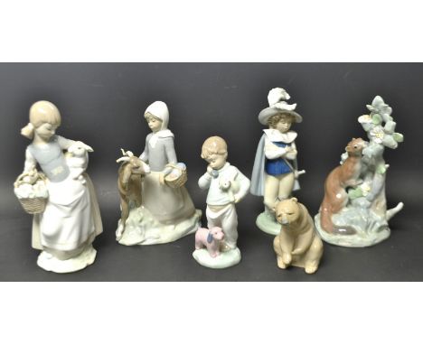 A Lladro model of a stoat; others, little girl with a lamb, girl with a goat, a LLadro Daisa bear; two other Nao figures (6)