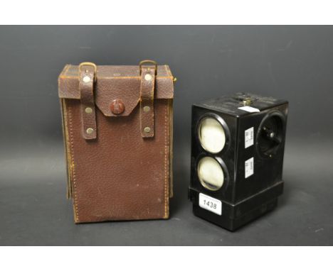 A Skymaster Ghost pigeon racing clock, serial number A1107, brown leather carry case