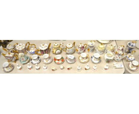 A collection of Regal porcelain miniature tea and coffee pots; Leonardo and other miniature cups and saucers; Lysander miniat