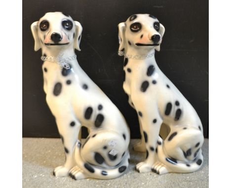 A pair of Dalmation ceramic floor standing dogs, 44cm