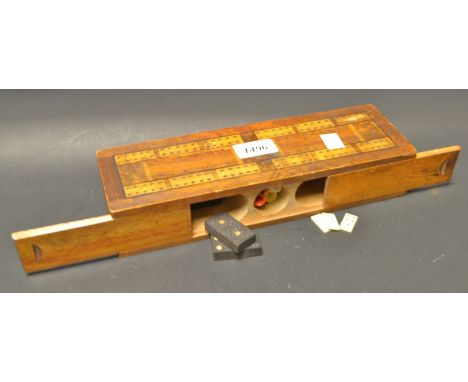 Folk Art - an early 20th century combination cribbage board/games compendium, two sliding covers enclose three hollowed apert