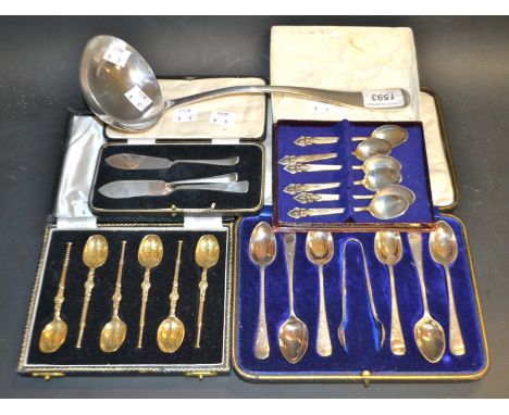 A set of six silver gilt anointing spoons, Birmingham 1951, cased; a set of six Thai silver teaspoons; a pair of silver butte