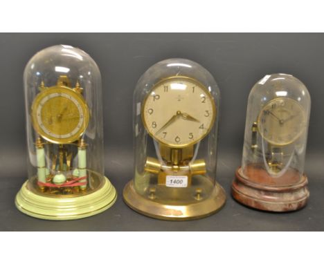A Junghans ATO  lacquered brass electric perpetual mantel clock, glass dome, 27cm high; another 800 day electric mantel clock