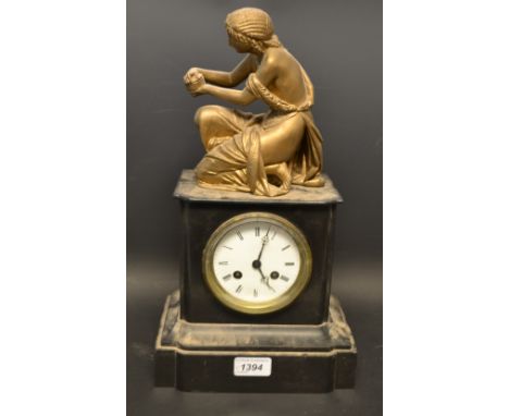 A late 19th century French black slate mantel clock, surmounted with a gilt brass classical mythical figure, Pandora poised t