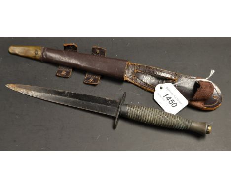 A Fairbairn Sykes commando knife and scabbard