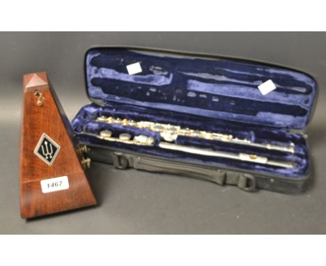 A silverplated 10ox Trevor J James flute, cased;  a German metronome (2) 
