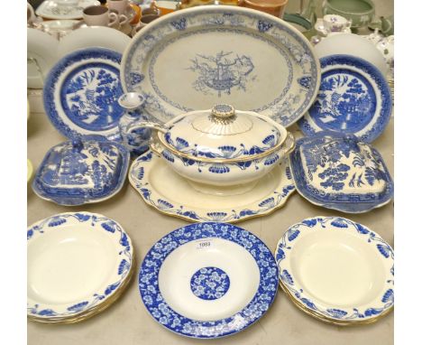 A Wedgwood Cyprus pattern large oval tureen and cover with ladle, meat plate, seven soup dishes; Willow pattern blue and whit