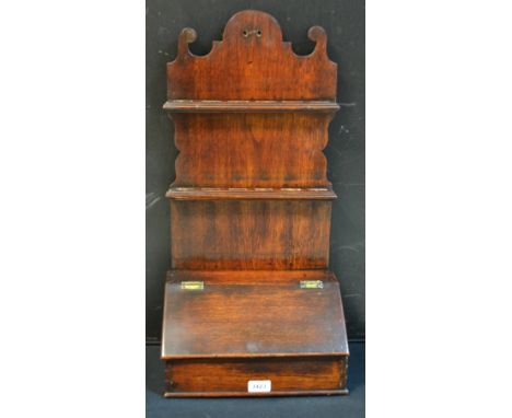 A 19th century oak wall hanging candle box, spoon rack back
