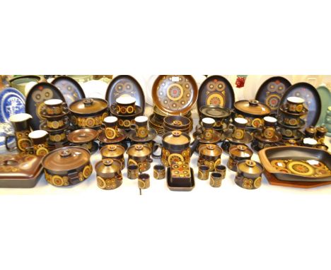 A Denby Arabesque dinner service, comprising service dishes and tureens, covered soup bowls, coffee and tea cups and saucers,