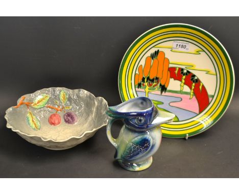 A Wedgwood Clarice Cliff Solitude plate; a Lustre jug, as a bird; a Shorter and Son fruit bowl (3)