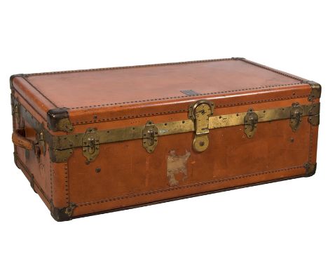 Travel trunk branded ‘Oshkosh Trunks &amp; Luggage. Oshkosk, Wisconsin, USA’ made of wood, metal, leather, and gilded metal f