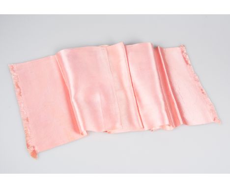 Hermès. Paris. Natural silk, long pink scarf, fringed at each end.A little worn and with a small tear.Vintage.110 x 28 cm.