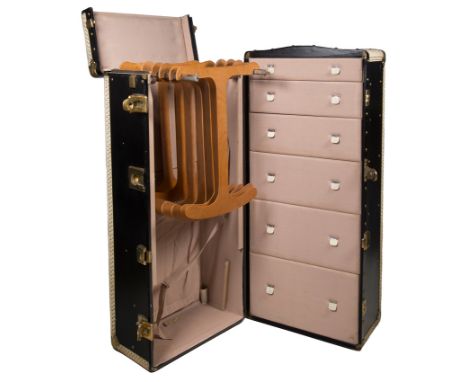 Large travel trunk made of wood, metal, leather, and gilded metal fittings. 1920s - 30s.Vintage.Vertical opening, with six dr