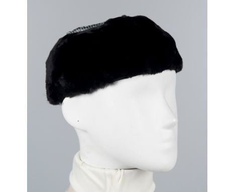 Henri Bendel. Paris. New York. Black velvet cap with netting on the crown.Features two small interior combs for securing the 