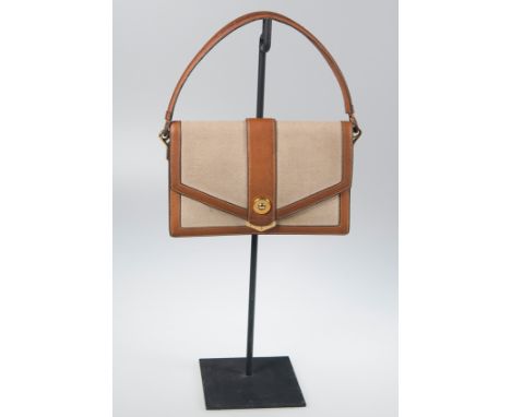 Hermès. Paris. Canvas "Piano" bag iwith&nbsp;caramel-coloured leather and gilt trimming. Circa 1950 - 1960.Vintage.
