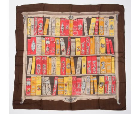 Hermès. Paris. "Bibliotheque". Women's natural silk scarf with printed design.Designed by Hugo Grygkar.There is a small hole 