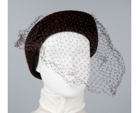 Brown velvet cap with netting to cover the face.The netting has tears at the top.Vintage.
