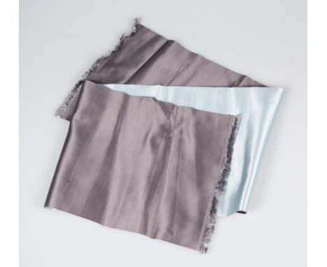 Hermès. Paris. Natural silk, long scarf in taupe grey and grey-blue, fringed at each end.Slightly stained on the blue section