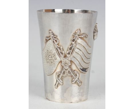 A Chinese silver beaker, early 20th century, of tapering cylindrical form, decorated in relief with a dragon chasing a flamin