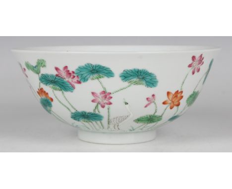 A Chinese famille rose porcelain circular bowl, mark of Daoguang but later, the exterior painted with cranes amongst lotus, u