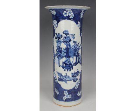 A Chinese blue and white porcelain cylinder vase, late 19th century, the body painted with opposing precious vessel and flowe