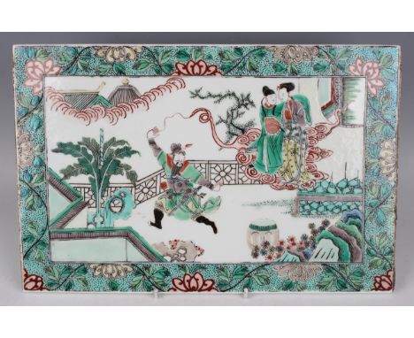 A Chinese famille verte porcelain rectangular plaque, late 19th century, painted with a dancing warrior god producing a cloud