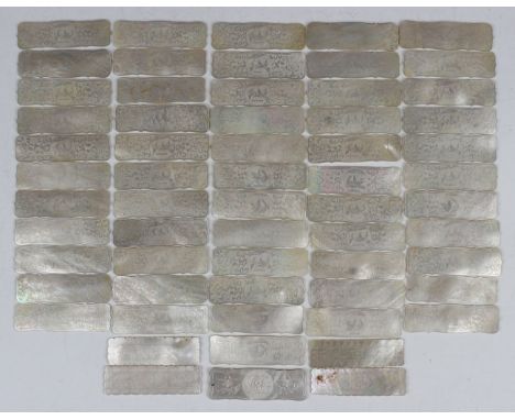 A collection of Chinese Canton export mother-of-pearl gaming counters, mid to late 19th century, the vast majority with incis