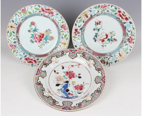 A pair of Chinese famille rose export porcelain plates, Yongzheng period, each painted with a central peony and flower spray 