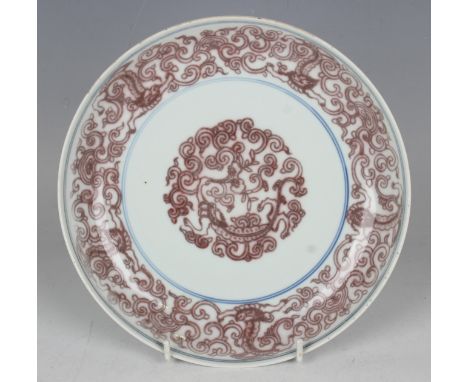 A Chinese underglaze red and blue porcelain saucer dish, mark of Chenghua but later, the interior and underside of rim painte